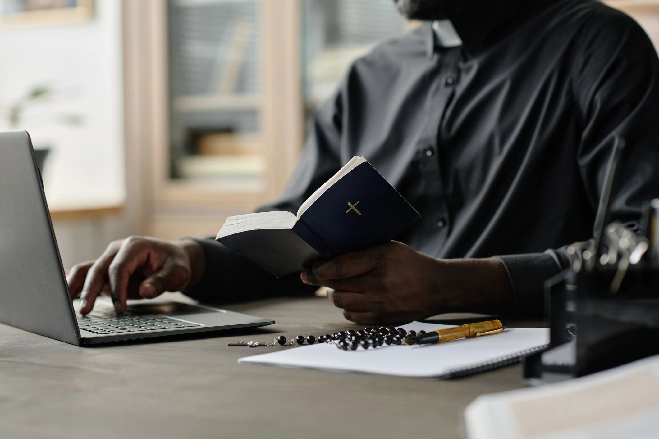 Pastor studying Scripture at a desk