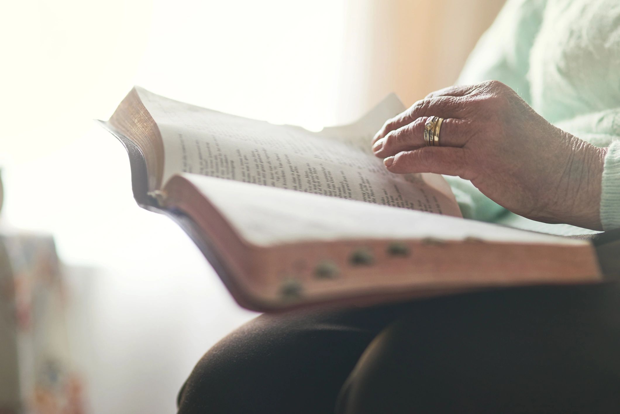Person reading a Bible during quiet study